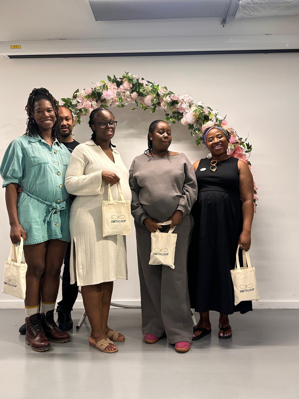 Guests at a Birth Loop session, each leaving with a Birth Loop tote bag